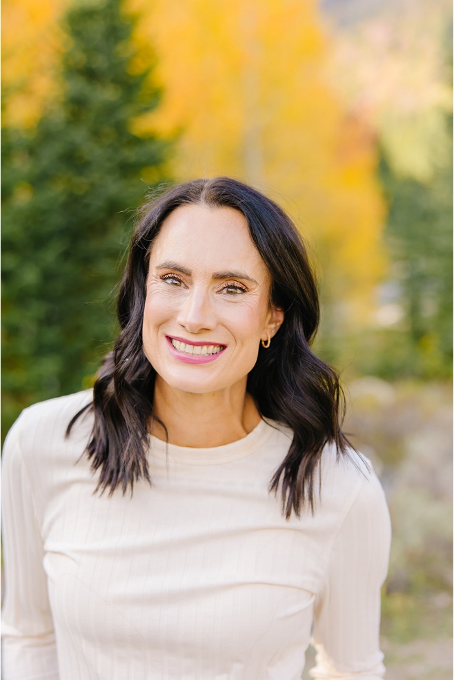Close-up portrait of a mom in a cream ribbed knit sweater in a Utah canyon